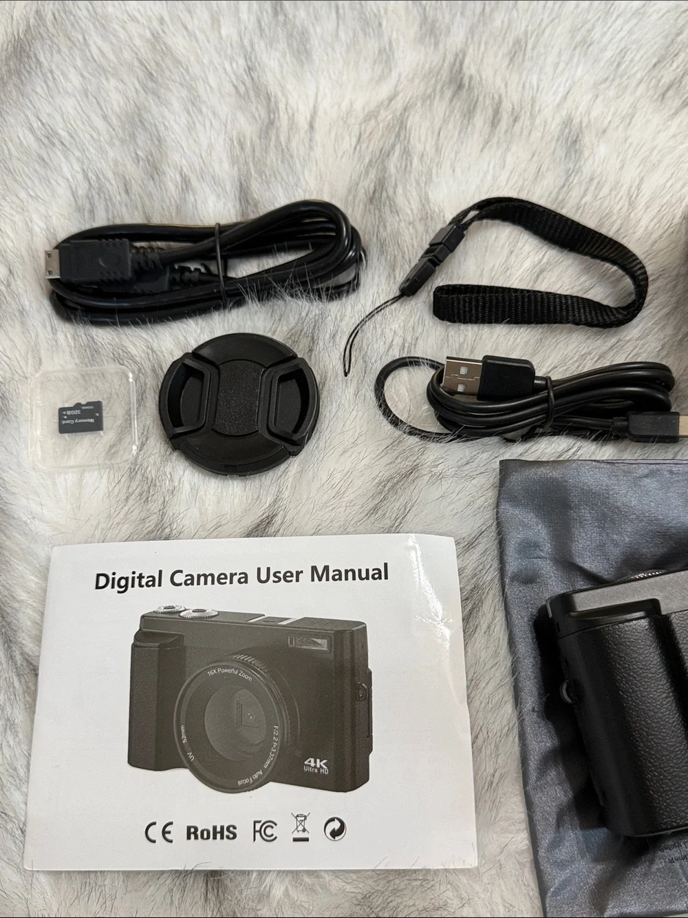 Compact Black Digital Camera with Accessories